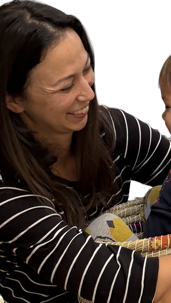 Liz, who built Tender Years, smiling at her toddler